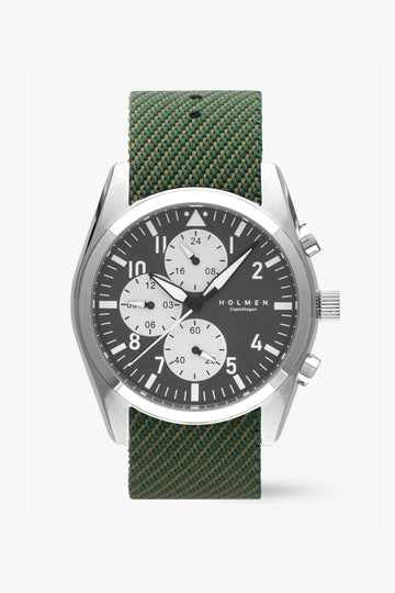 Wristwatch with green strap and silver case on a white background