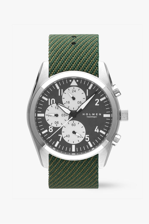 Wristwatch with green strap and silver case on a white background