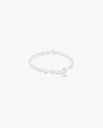 Silver bracelet on a light grey background