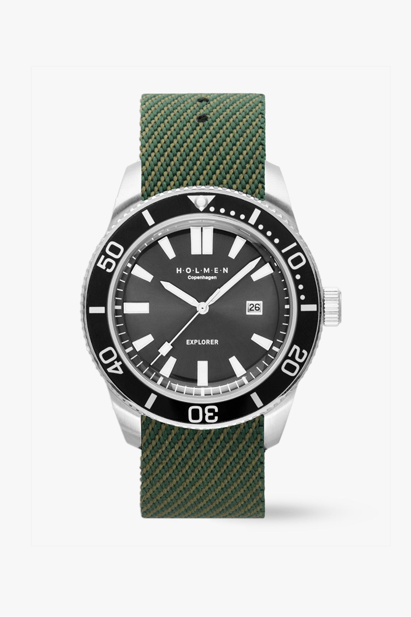 Watch with green strap and black dial on a white background