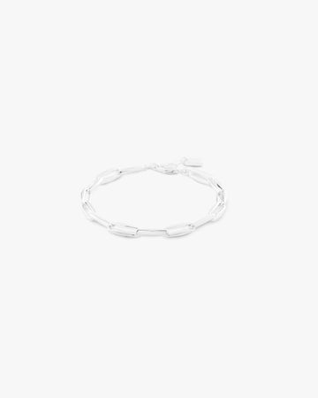 Silver bracelet on a light grey background