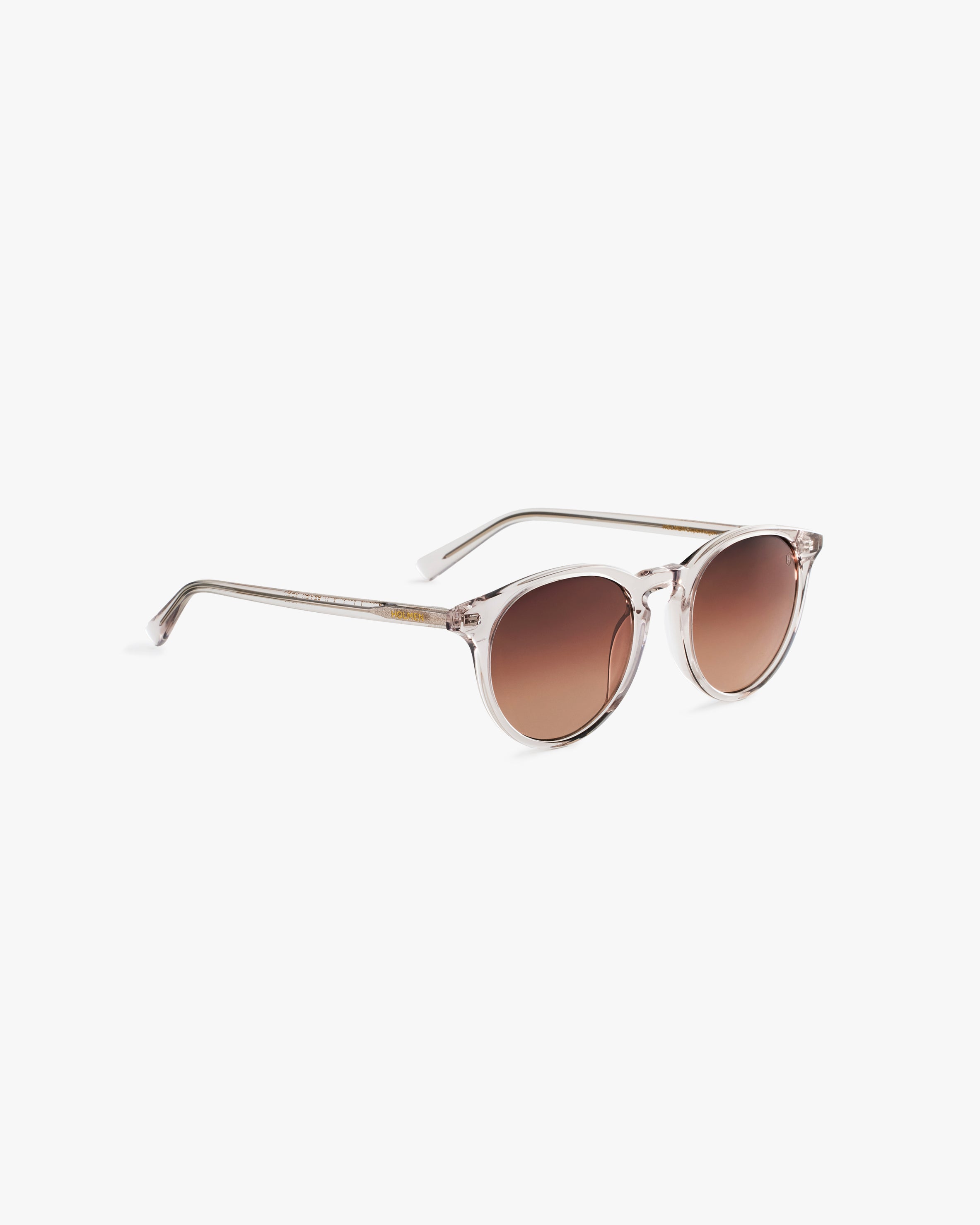 Sunglasses with brown gradient lenses on a light grey background