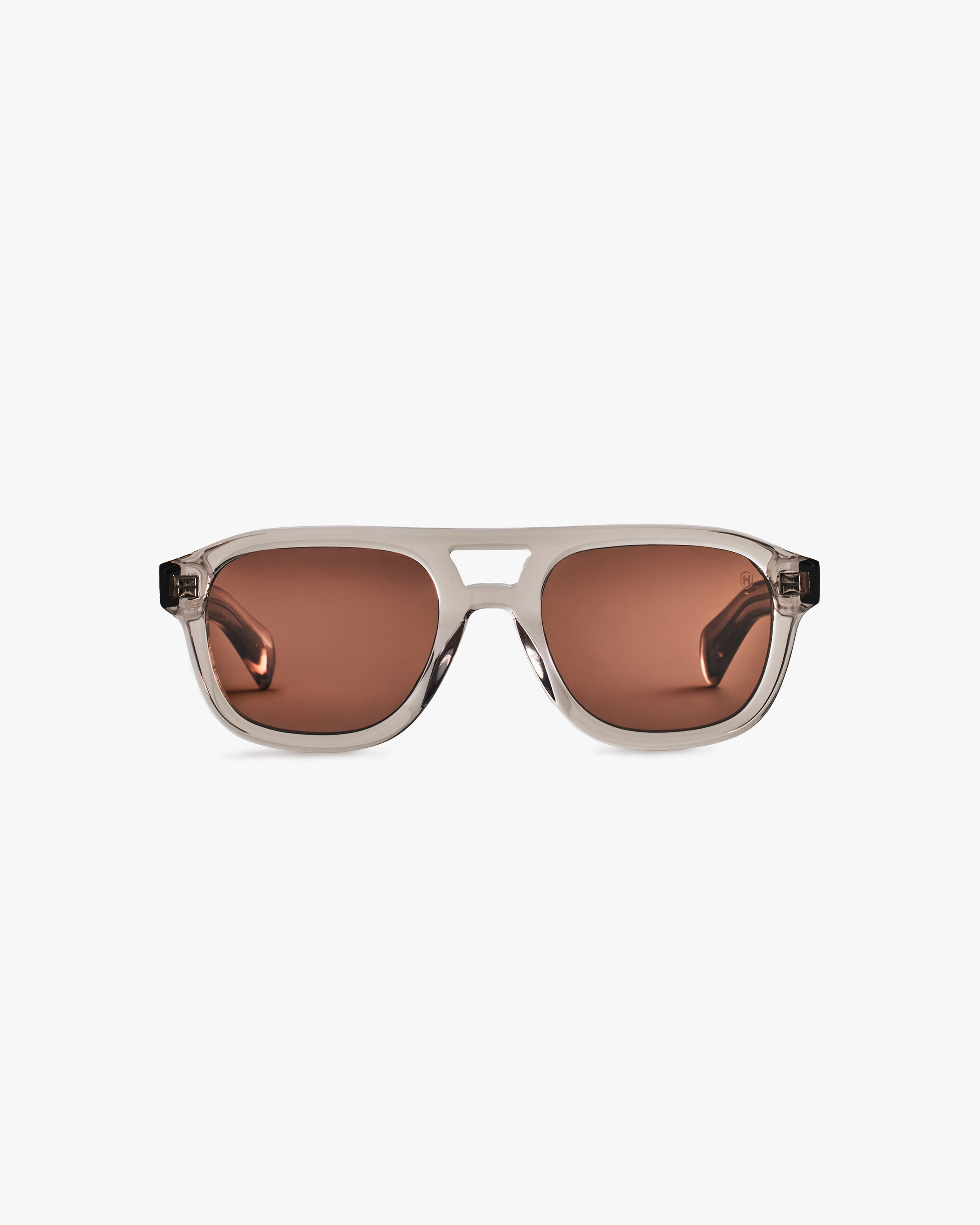 Sunglasses with brown lenses on a light grey background