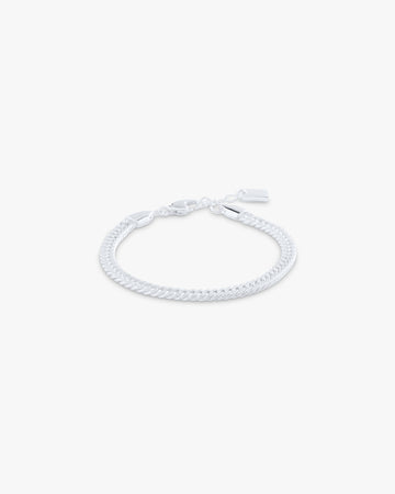 White braided bracelet on a light gray background